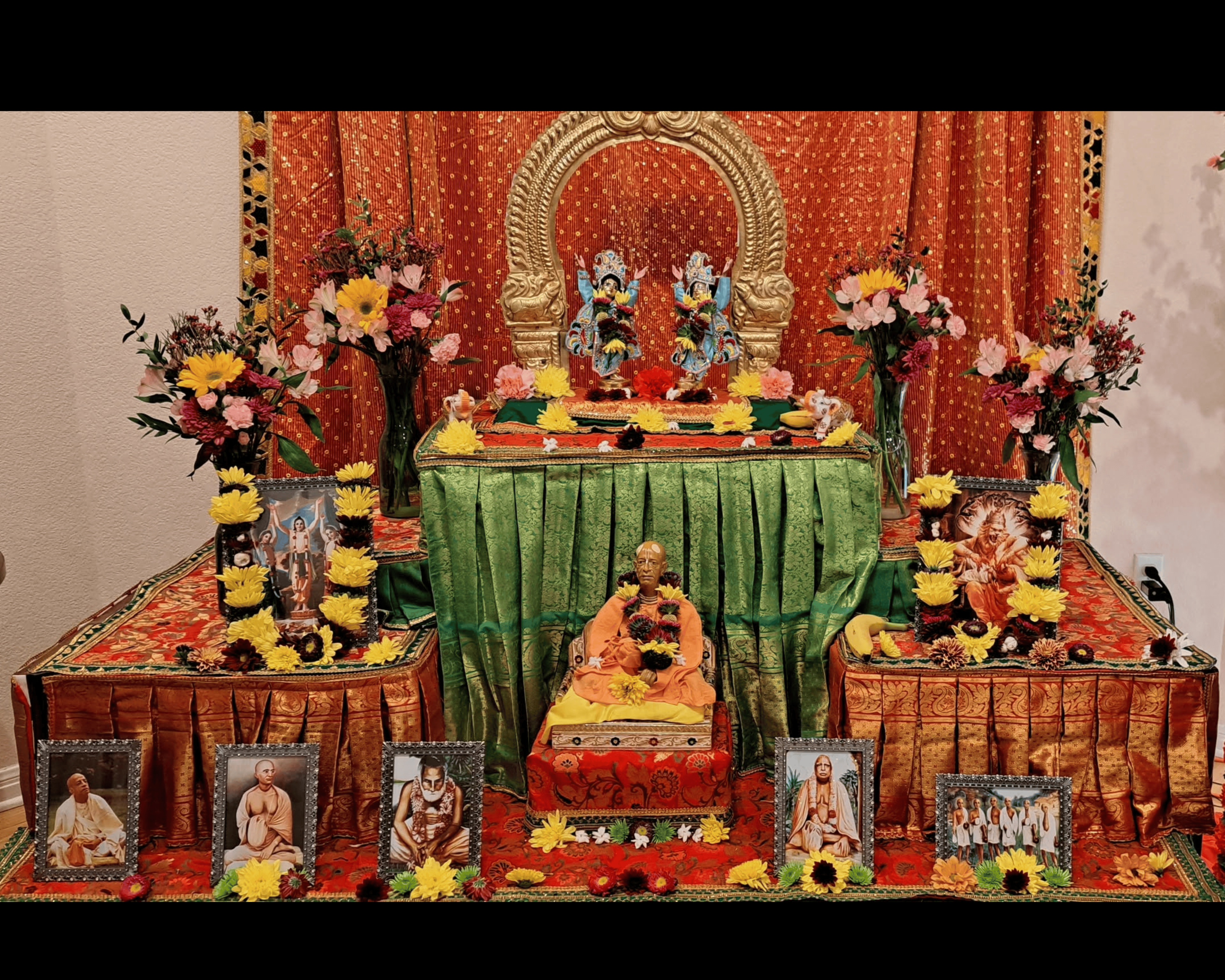 Beautiful deity altar with devotional decorations at ISKCON Cedar Park