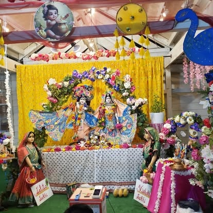 Colorful Krishna altar with floral decorations at ISKCON Cedar Park