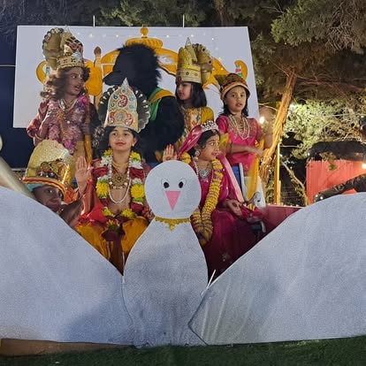 Hindu deity figures in ceremonial display with peacock at ISKCON Cedar Park