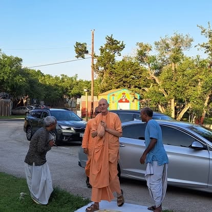 Monk blessing devotees at ISKCON Cedar Park