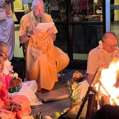 Monks performing ritual ceremony with fire at ISKCON Cedar Park